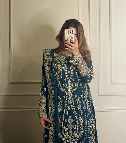 Exclusive Party Wear Outfit in Heavy Faux Georgette with Rivet Moti and Embroidery Work